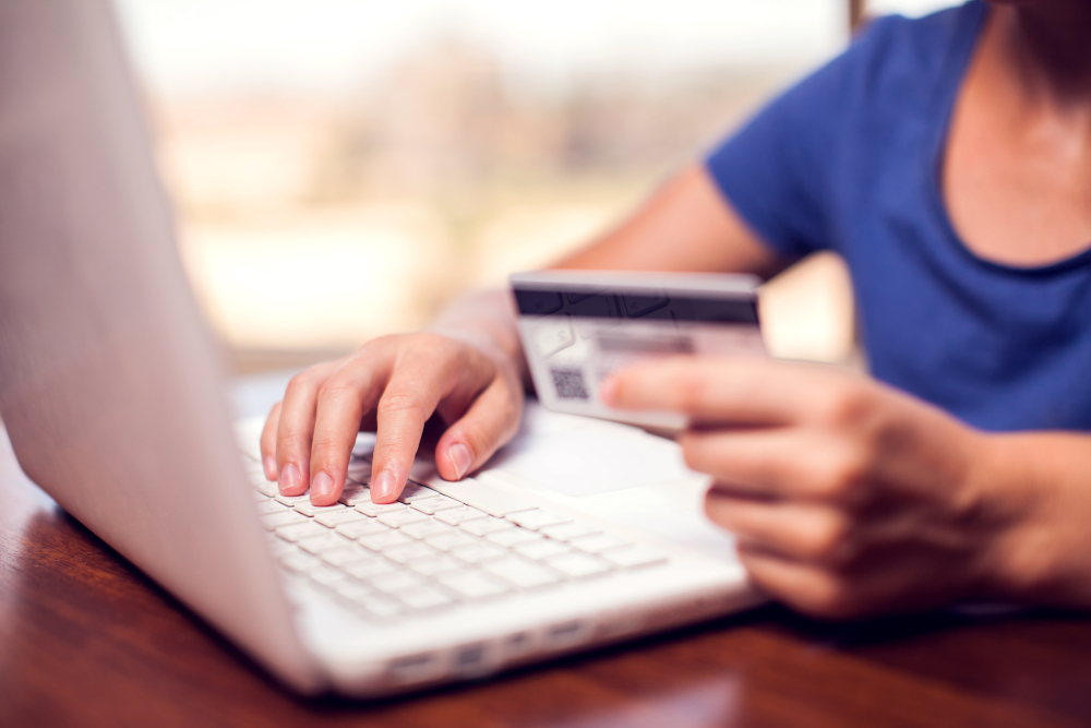 Woman makes online payment with laptop.